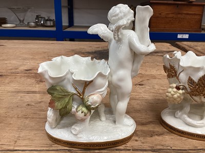 Lot 104 - Two similar late 19th century Moore Bros. porcelain sweetmeat baskets decorated with cherubs and gilt ornament, Greek Key pattern to footrims, stamped and impressed marks, 16.5cm high
