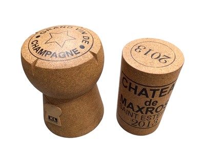 Lot 425 - Two novelty stools in the form of a champagne cork, 49cm high and a wine cork 43.5cm high