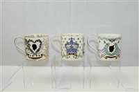 Lot 2215 - Three Wedgwood commemorative mugs designed by...