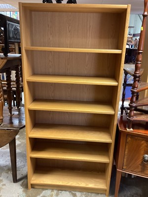 Lot 1263 - Mark Elliot Furniture light oak two height cabinet, with two glazed doors above, recess, two drawers and two panelled doors below, 121cm wide, 47cm deep, 211cm high