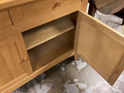 Lot 1264 - Mark Elliot light oak sideboard with two drawers and two panelled doors below, 121cm wide, 48cm deep, 87.5cm high