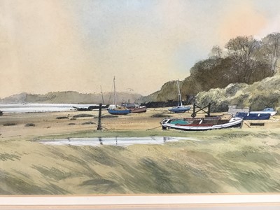 Lot 90 - Michael Norman watercolour - Boats lying below Freston Hill, signed and dated 1990, 28.5cm x 45.5cm in glazed frame
