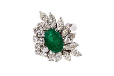 Lot 696 - Emerald and diamond cocktail ring, the asymmetrical cluster with a central oval mixed cut emerald and marquise cut snd brilliant cut diamonds in 18ct white gold setting