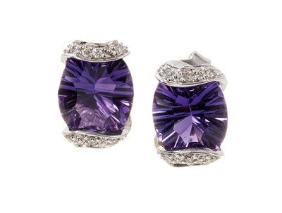 Lot 706 - Pair of amethyst and diamond earrings