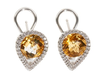 Lot 709 - Pair of citrine and diamond earrings