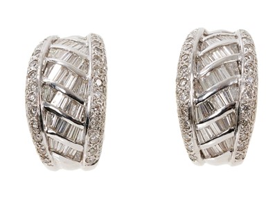 Lot 712 - Pair of diamond hoop earrings with baguette cut and brilliant cut diamonds in 18ct white gold setting