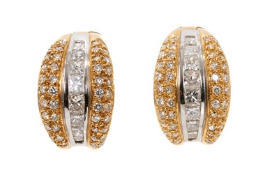 Lot 716 - Pair of white and yellow gold diamond earrings