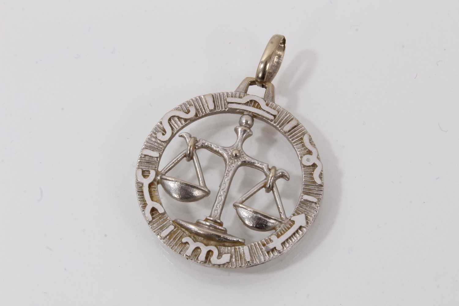 Lot 721 - 18ct white gold Libra pendant