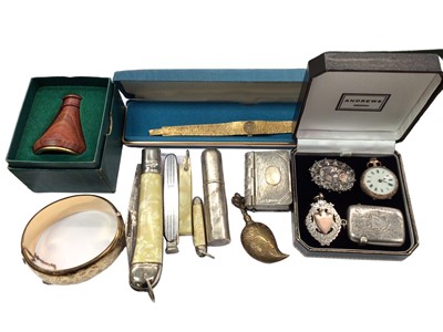 Lot 1060 - Silver perfume bottle, silver vesta case, one other plated vesta in the form of a book, two silver brooches, silver fob watch, gold plated watch and bangle, penknives etc