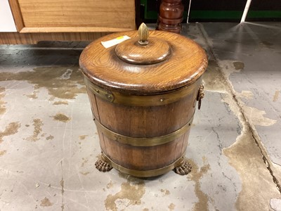 Lot 1274 - Brass bound oak coal bucket with lid and lead liner standing on paw feet