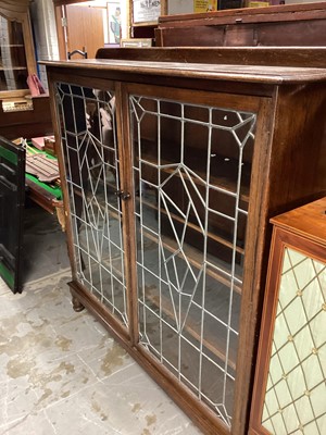 Lot 1276 - Early 20th century oak bookcase with shelved interior enclosed by two leaded glazed doors, 141cm wide, 31.5cm deep, 150cm high