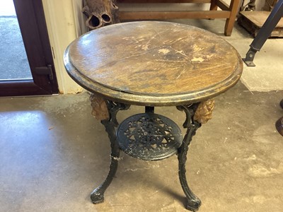 Lot 1282 - Cast iron circular garden table with circular wooden top, 60cm diameter