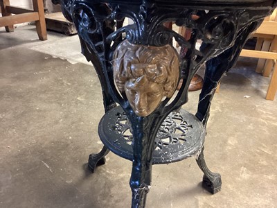 Lot 1282 - Cast iron circular garden table with circular wooden top, 60cm diameter