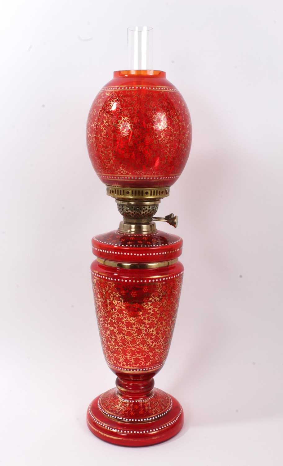 Lot 214 Victorian cranberry glass oil lamp with