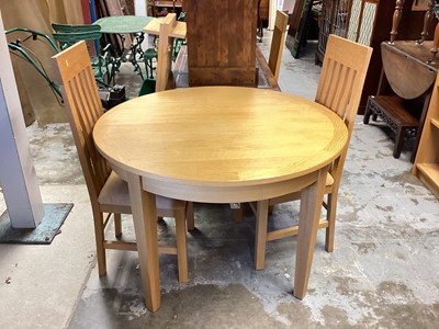 Lot 1283 - Mark Elliot light oak extending dining table with two extra leaves, 111cm diameter, leaves each measure 46.5cm, together with six matching dining chairs