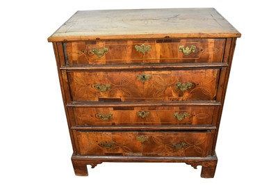 Lot 1554 - Early 18th century inlaid walnut chest of four long drawers