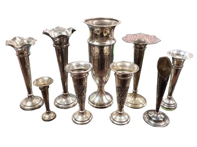 Lot 1074 - Pair of Art Nouveau silver spill vases with stylised stork decoration, together with seven other silver vases (9)