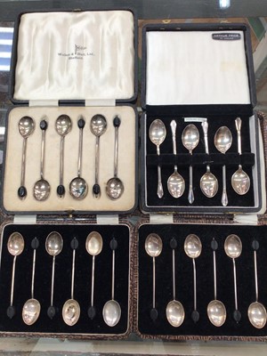 Lot 1075 - Four cased sets of six silver coffee spoons