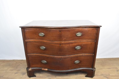 Lot 1569 - George III mahogany serpentine fronted chest of three long drawers