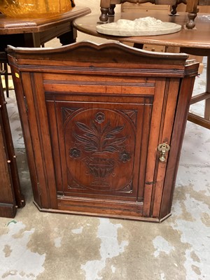 Lot 1343 - Late Victorian carved walnut corner cupboard, together with a fire screen (2)