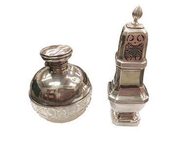 Lot 1092 - Silver sugar caster and a silver mounted cut glass spherical perfume bottle (2)