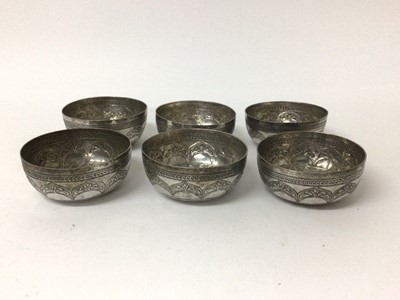 Lot 205 - Set of six Eastern white metal bowls, with foliate patterns in relief, 10cm diameter