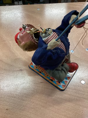 Lot 1894 - Vintage Japanese tinplate battery operated robot and a Japanese automaton clown with monkey playing the cymbals