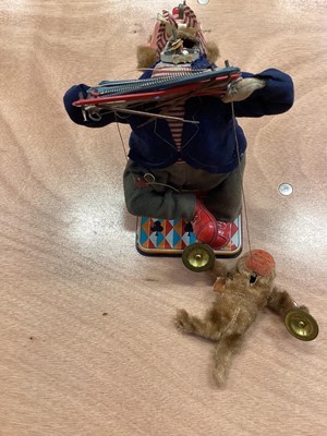Lot 1894 - Vintage Japanese tinplate battery operated robot and a Japanese automaton clown with monkey playing the cymbals