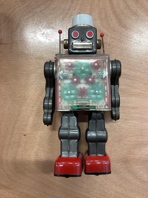 Lot 1894 - Vintage Japanese tinplate battery operated robot and a Japanese automaton clown with monkey playing the cymbals