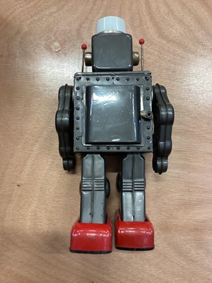 Lot 1894 - Vintage Japanese tinplate battery operated robot and a Japanese automaton clown with monkey playing the cymbals