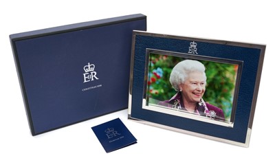 Lot 36 - H.M. Queen Elizabeth II, silver plated and leather photograph frame 2006 Royal Household Christmas present containing a charming photograph of Her Late Majesty with Crowned ERII cipher to frame and...