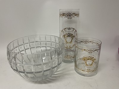 Lot 259 - Large Waterford Crystal 'Marquis' bowl, 24cm diameter, together with two Versace glass vases of cylindrical form with gilded decoration, 30cm and 16cm (3).