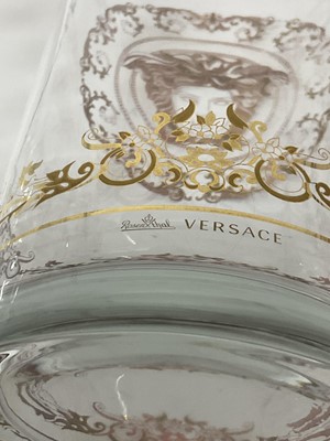 Lot 259 - Large Waterford Crystal 'Marquis' bowl, 24cm diameter, together with two Versace glass vases of cylindrical form with gilded decoration, 30cm and 16cm (3).