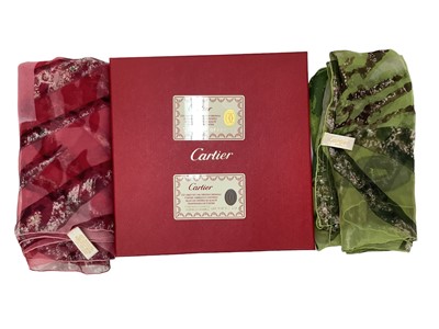 Lot 2098 - Two Cartier silk chiffon scarves  pink and green tiger's head both in one Cartier box