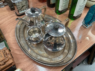 Lot 543 - Two early 20th century silver plated meat plates retailed by Harrods, together with a silver plated four piece teaset by S. Gladwin, Sheffield.