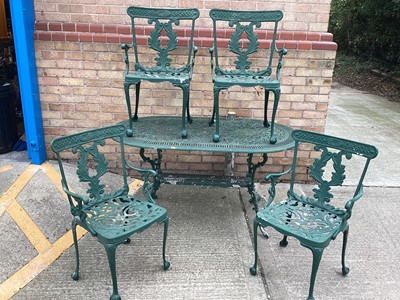 Lot 1375 - Cast aluminium garden table and four matching chairs