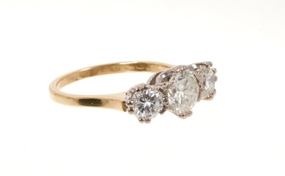 Lot 726 - Diamond three stone ring with three round brilliant cut diamonds in claw setting on 18ct yellow gold shank. Estimated total diamond weight approximately 1.70cts. Ring size N.