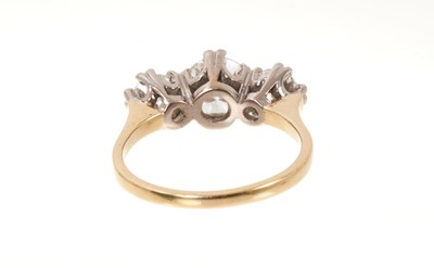 Lot 726 - Diamond three stone ring with three round brilliant cut diamonds in claw setting on 18ct yellow gold shank. Estimated total diamond weight approximately 1.70cts. Ring size N.