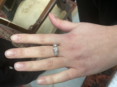 Lot 726 - Diamond three stone ring with three round brilliant cut diamonds in claw setting on 18ct yellow gold shank. Estimated total diamond weight approximately 1.70cts. Ring size N.