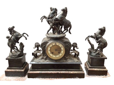 Lot 423 - Antique black slate and marble clock garniture with spelter figure and horse surmounts