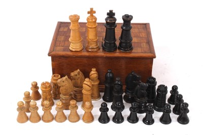 Lot 1065 - Scratch carved wooden chess set in box with chequerboard top