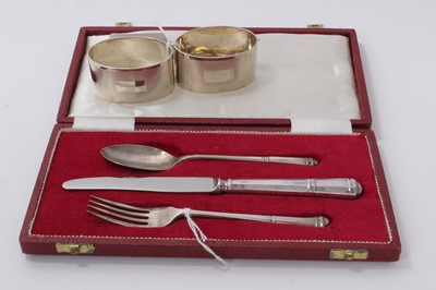 Lot 400 - Cased christening set, Sheffield 1972, and two napkin rings, Birmingham 1944