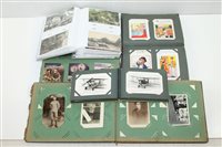 Lot 2494 - PostCarsds in five albums - including social...