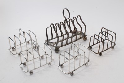 Lot 546 - Edwardian silver six division toast rack, (Sheffield 1906), maker Atkin Brothers, together with four other Edwardian silver four division toast