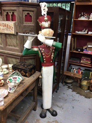 Lot 334 - Life size tin model of a soldier playing a pipe