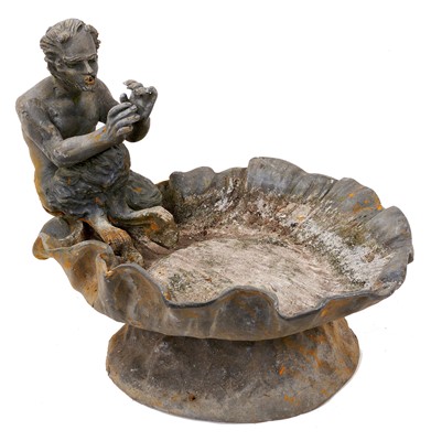 Lot 1607 - Antique lead bird bath with a figure of Pan, on a scalloped shell bowl