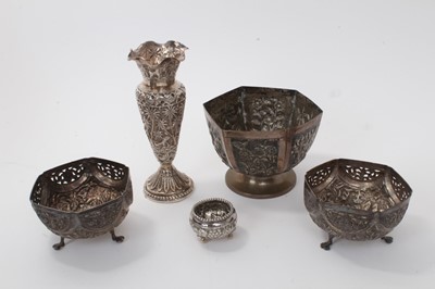 Lot 487 - Selection of late 19th/early 20th century Indian and other white metal, including a spill vase and a pair of dishes with pierced borders, with embossed jungle scene decoration, a salt and one other...