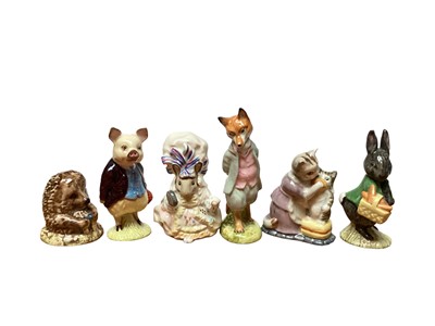 Lot 1129 - Eleven Beswick Beatrix Potter figures and a Beswick stand