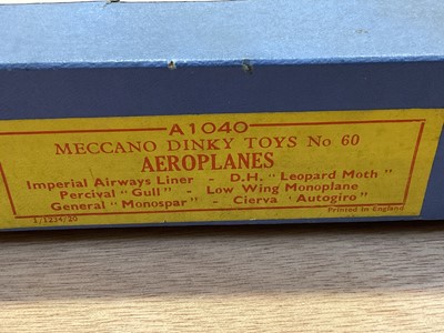 Lot 1835 - Dinky aeroplanes No. 60, Gloster Gladiator Biplane 60p, both empty boxes plus some unboxed aeroplanes including four engineed flying boat, Mayo Composite, Whitley Bomber and others (Qty)