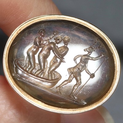 Lot 811 - George III yellow gold fob seal, containing an 18th century or earlier chalcedony intaglio depicting Diana bathing with nymphs and Acteon transformed as a stag.